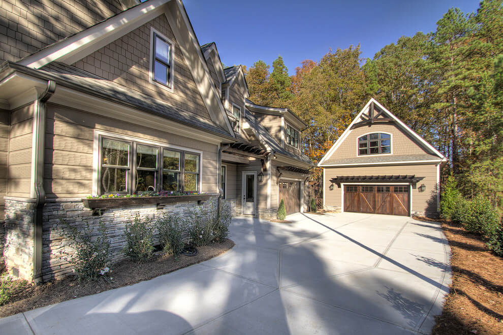 Modern Driveway Paver Green Modern Driveway Put concrete circular driveway at high-end house High-end house with circular driveway Pavers driveway at luxury house Paver driveway in front of house Slate stone pavers driveway at high-end house Brick driveway to house with waterside views Modern concrete driveway Modern house with concrete driveway Asphalt and concrete driveway at modern home Gravel driveway at English countryside home Loose gravel driveway at nation house Curved gravel driveway style at modern house Modern pattern driveway in front of house